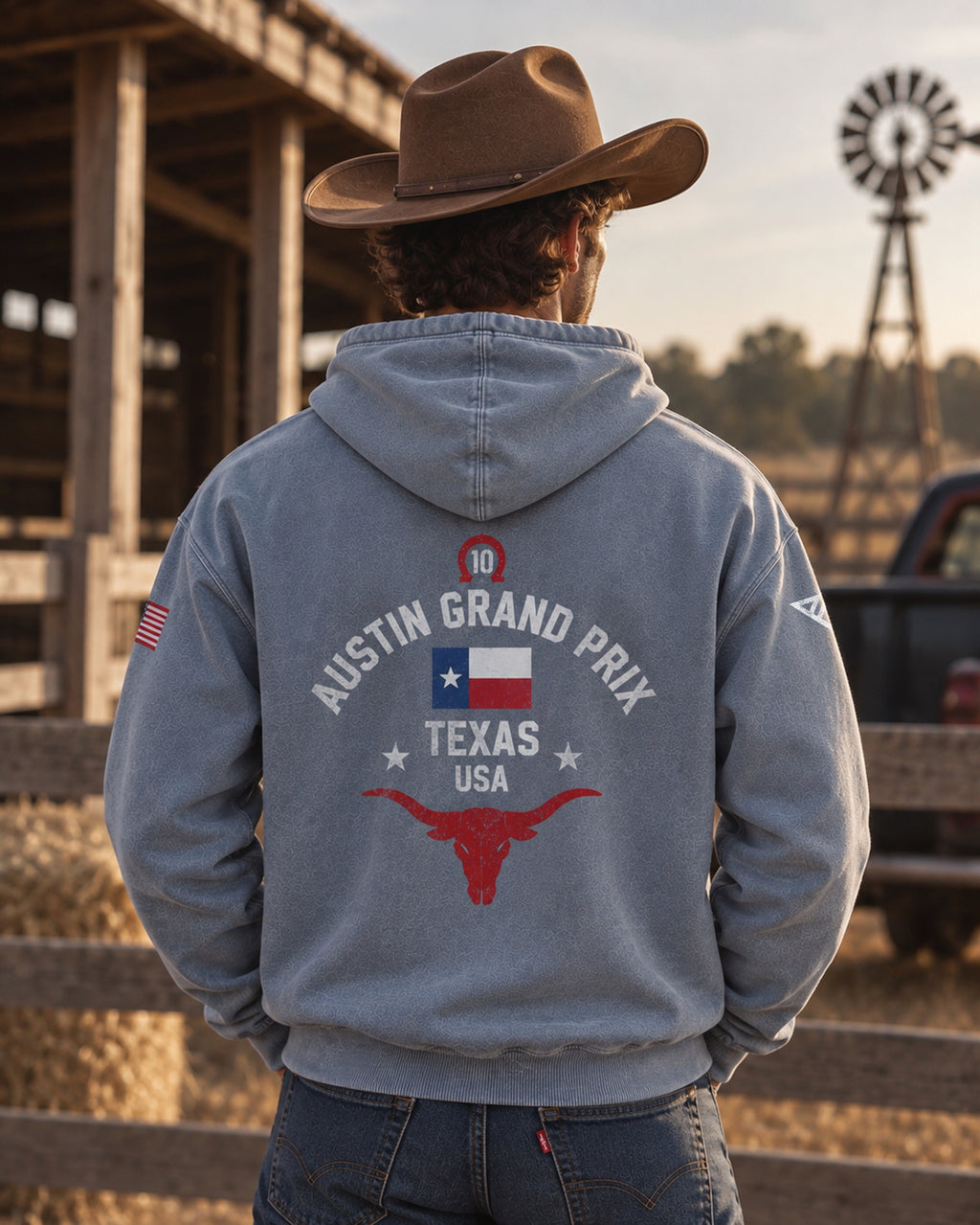 Man in a cowboy hat wearing the blue Pierre Gasly Austin Hoodie, back print Austin Grand Prix Texas USA