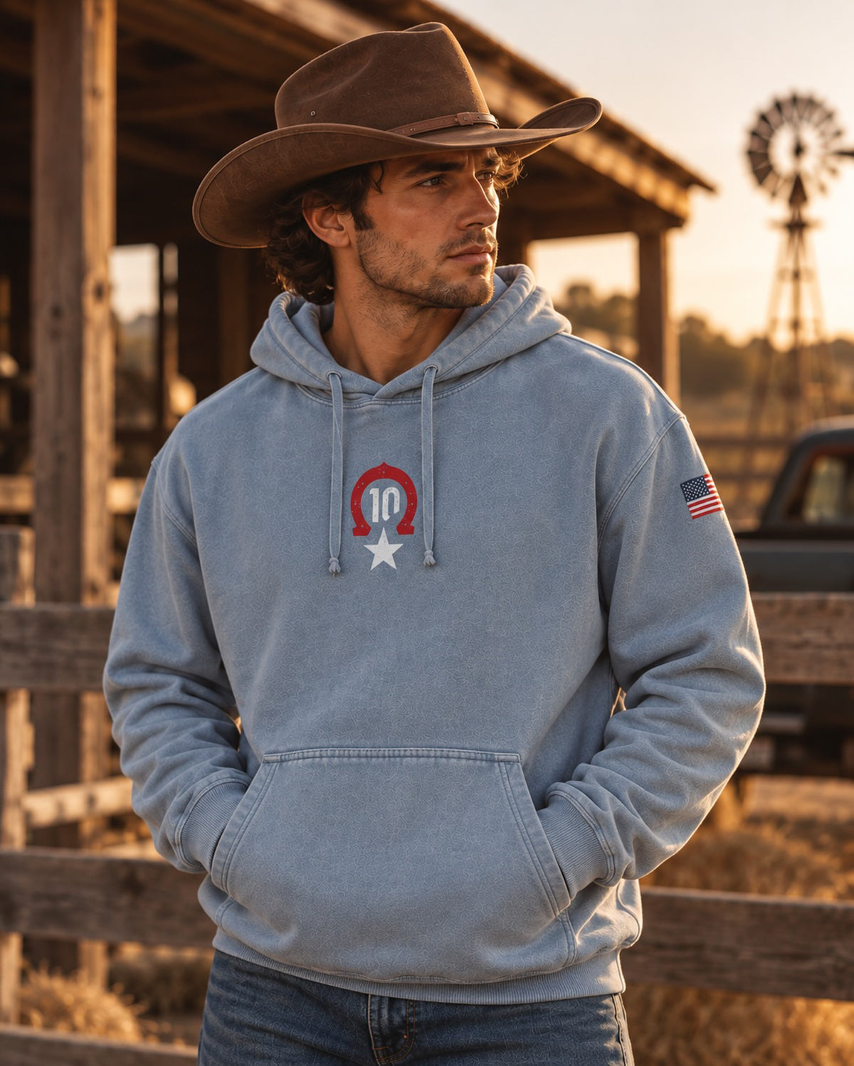 Man in a cowboy hat wearing the blue Pierre Gasly Austin Hoodie, front view