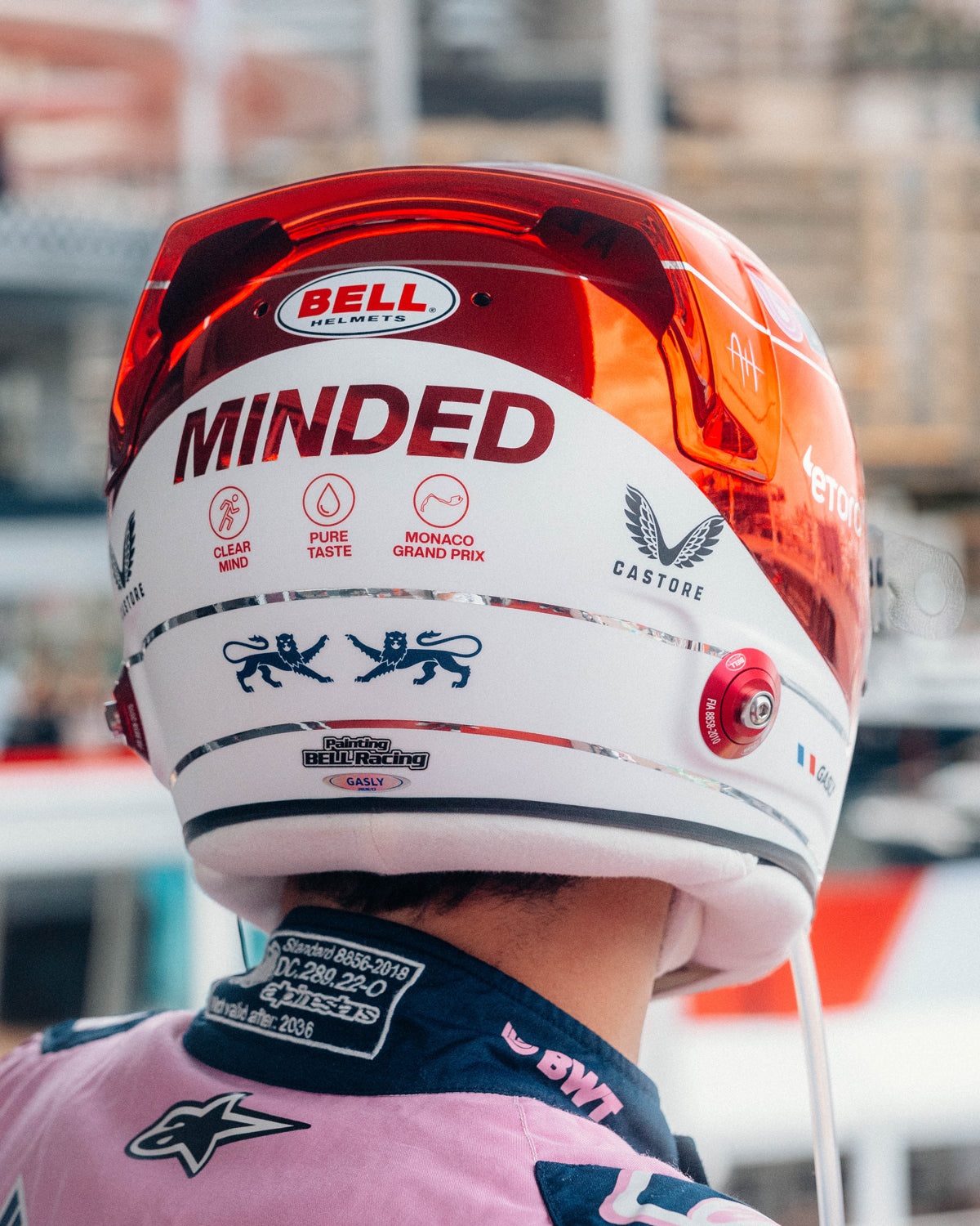 Rear of Pierre Gasly's 2026 Monaco Grand Prix race helmet — white section with MINDED wordmark and Clear Mind, Pure Taste, Monaco Grand Prix icons